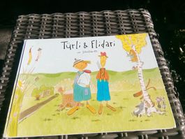 Türli & Flidari - Im Schollariet (Bilderbuch)  ©2011 IFKI
