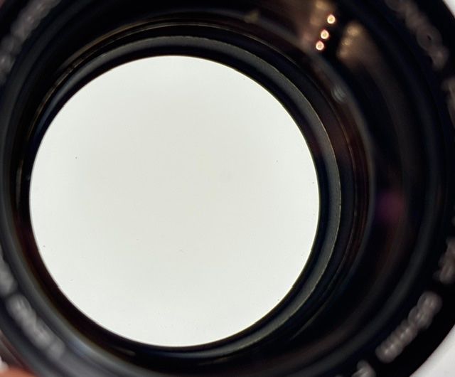 Konica Obiettivi: Konica Hexanon AR 85mm F1.8 / 1.8 EE-Version + Insekt? – Usato da Seewis Dorf venduto da Plebejus 5
