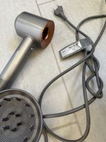defekter Haartrockner Dyson Supersonic grau 