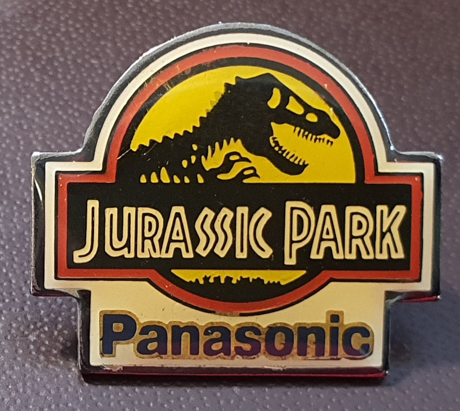 Placchette & Badge: Q314 - Pin Jurassic Park Logo Panasonic – Usato da Reinach BL venduto da Boston-Verkauf