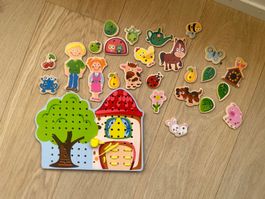 Steckspiel mit Motiven zum Fädeln