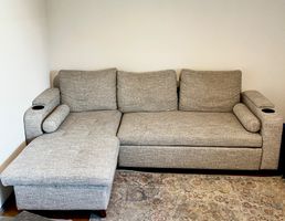 Ecksofa mit Schlaffunktion und Bettkasten hellgrau