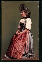 Junge Dame in Schweizer Tracht mit dunkl