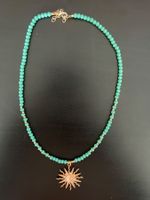 Collier turquoise avec pendentif soleil doré
