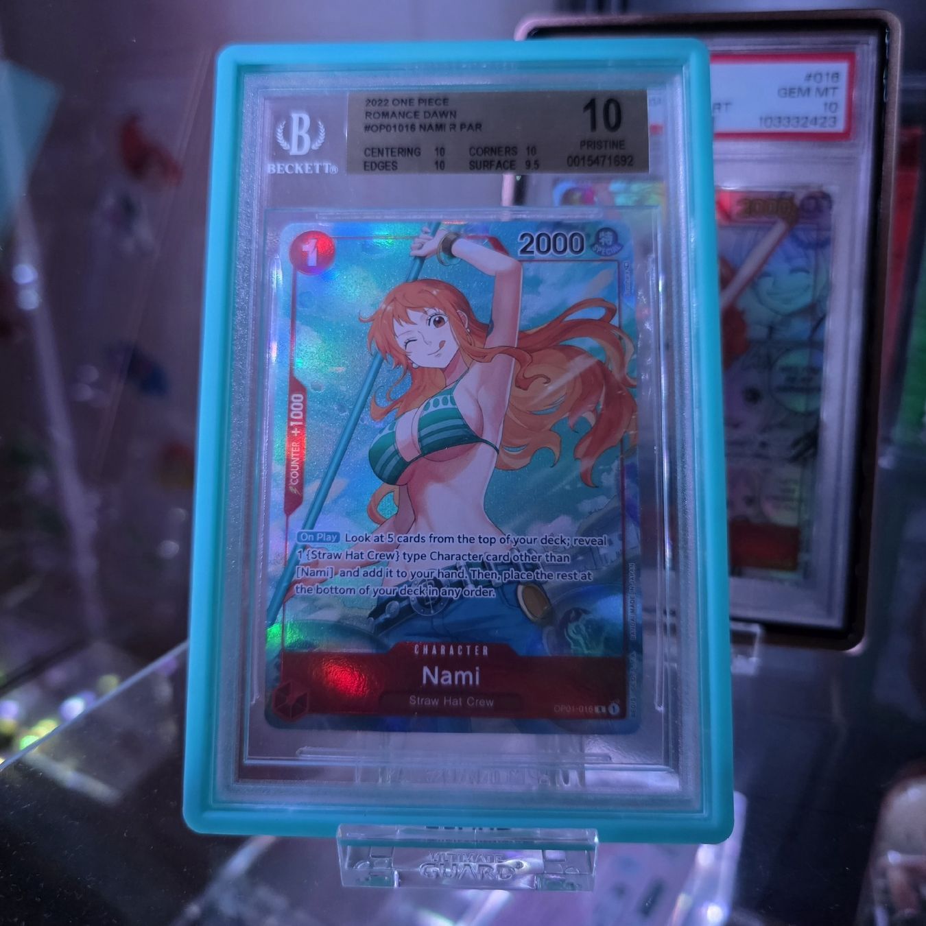 Bandai Carte collezionabili: One Piece - Nami Op01 Pre Errata BGS 10 – Nuovo (secondo la descrizione) da Bern venduto da HotOden