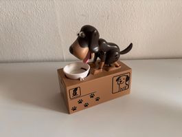 Sparkässeli, Hund der Münzen isst