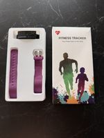 Fitness Tracker lila Armband neu in Originalverpackung