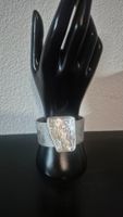 Bracciale in similpelle con decorazione geometrica metallica