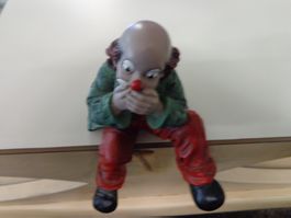 Gilde Clown sitzend Hand vor dem Mund Spezial