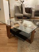 Wohnzimmertisch Glasplatte Holzoptik schwarz Ablage