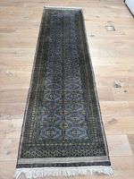 Tapis chemin gris / bleu à motifs géométriques dorés