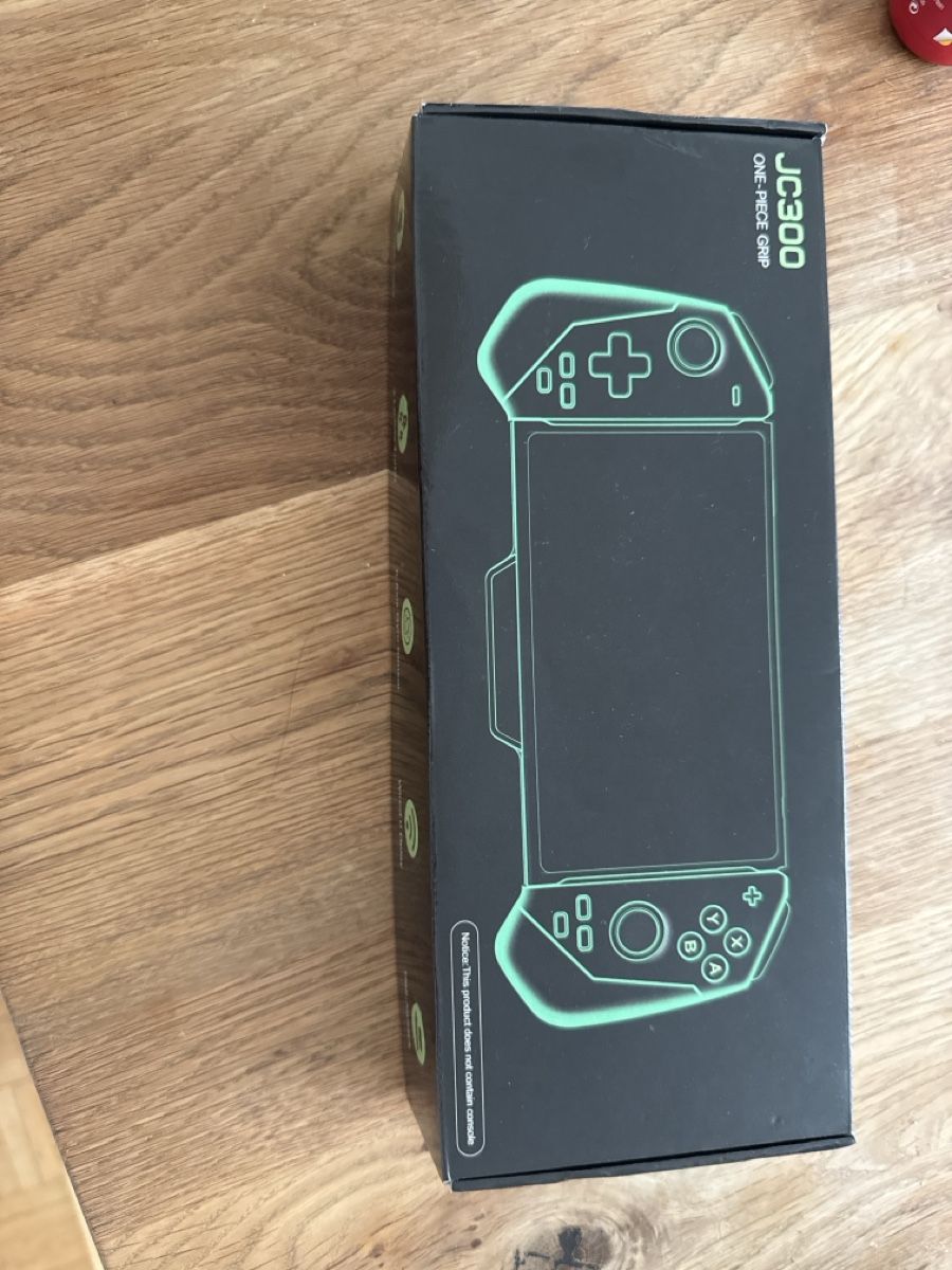 Manettes: Game Controller JC300 One-Piece Grip NEU – Neuf avec emballage d'origine à Au SG par gio_kh75