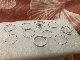 10 stapelbare feine, zarte silberf. Ringe,verschiedene Sujet