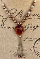 Superbe collier LDADPR effet perle et verre brun taillé