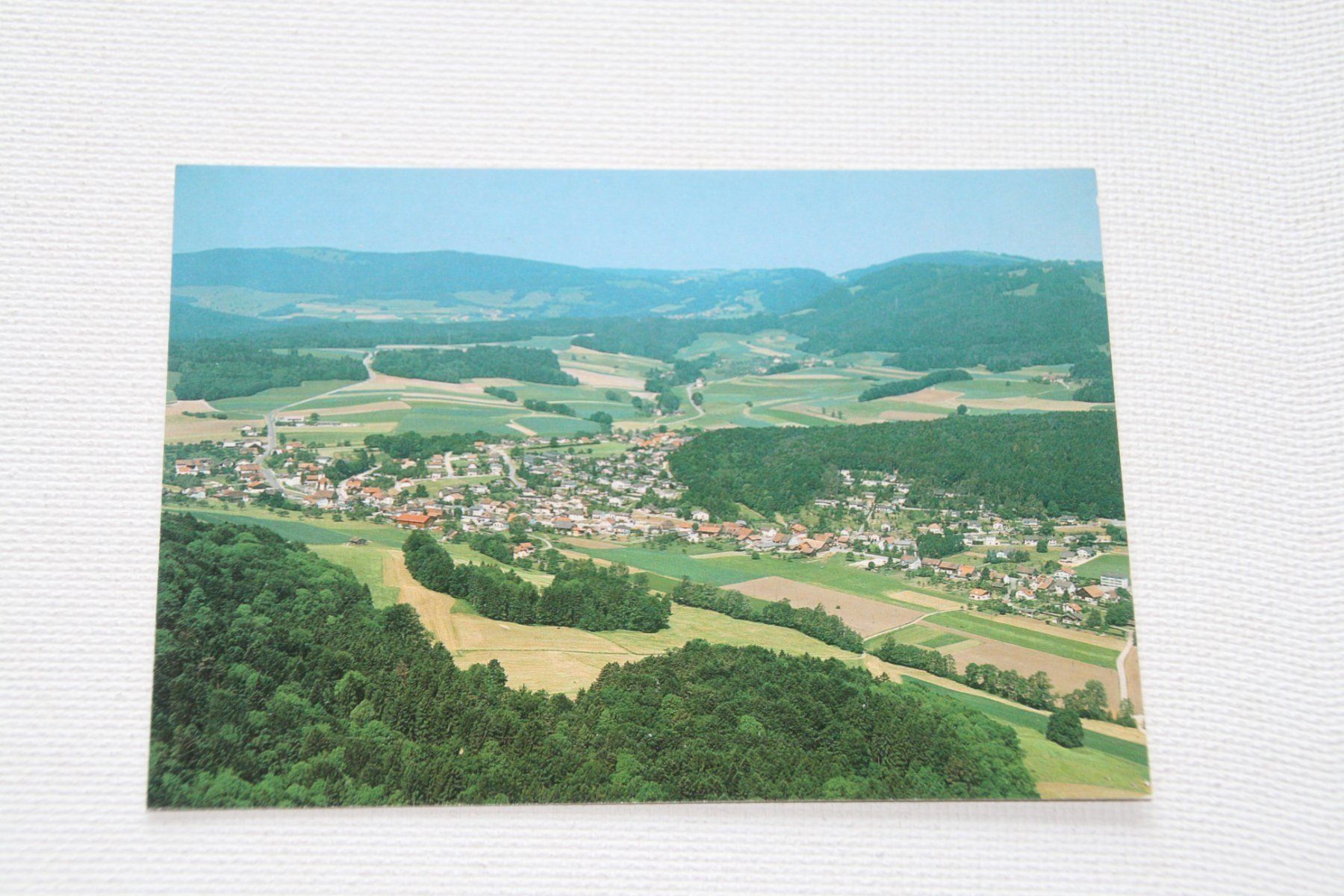 Cartoline postali: DEVELIER VUE AERIENNE 2 – Usato da Develier venduto da Syncope
