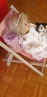 Vintage Puppe im Liegestuhl