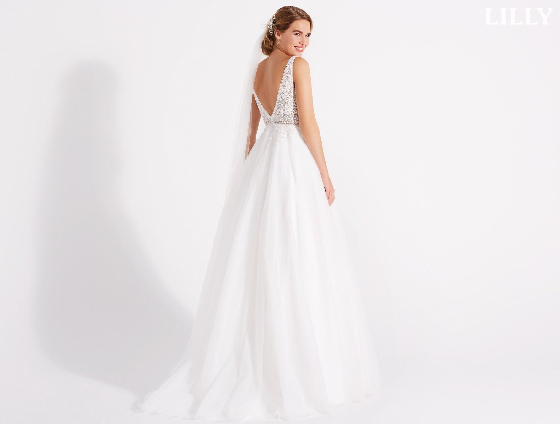 Kleider: Secondhand Brautkleid von Lilly, Grösse 42 – Gebraucht aus Brunnen von Herzig-Brautmode 1