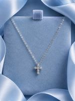 Kleines Kreuz aus 18-karätigem Weißgold mit Diamanten