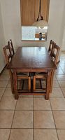 Table en bois massif avec 2 rallonges et 6 chaises