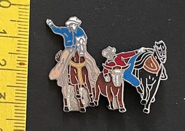 Cowboys mit Pferden und Rind/ Pin
