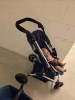 Baby Born mit Kinderwagen, blau