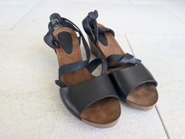 Black leather wedge sandals with ankle straps