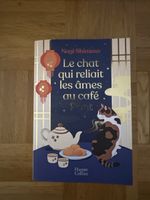 Livre Le chat qui reliait les âmes au café Pont neuf