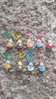 Diverse niedliche Labubu Anhänger auf Schaukelpferd