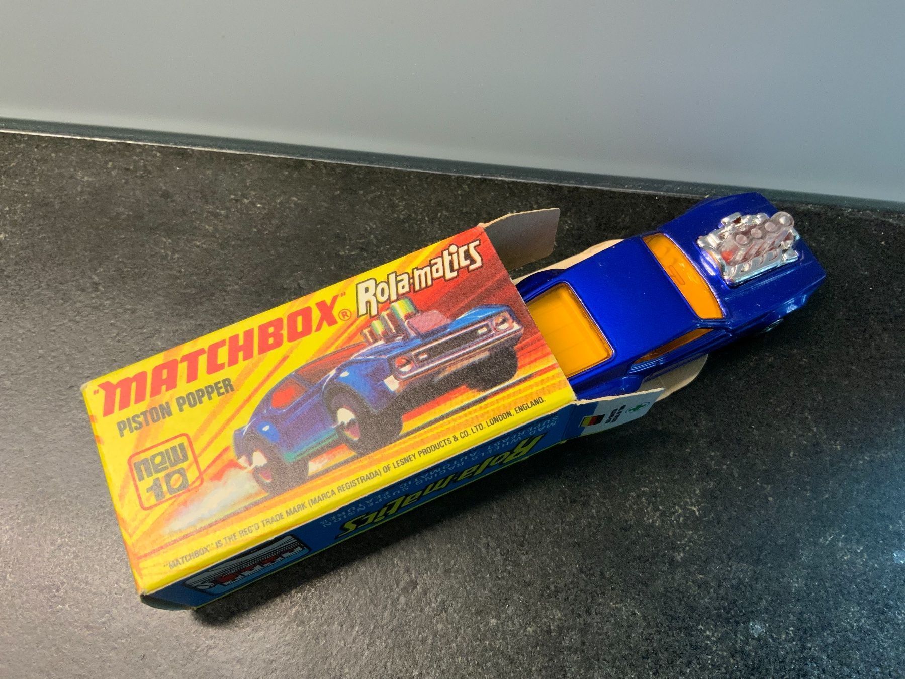 Matchbox Modellini d'auto: MATCHBOX Rola-matics Nr.10, PISTON POPPER – Nuovo e nell'imballaggio originale da Erlenbach im Simmental venduto da Model_box 4