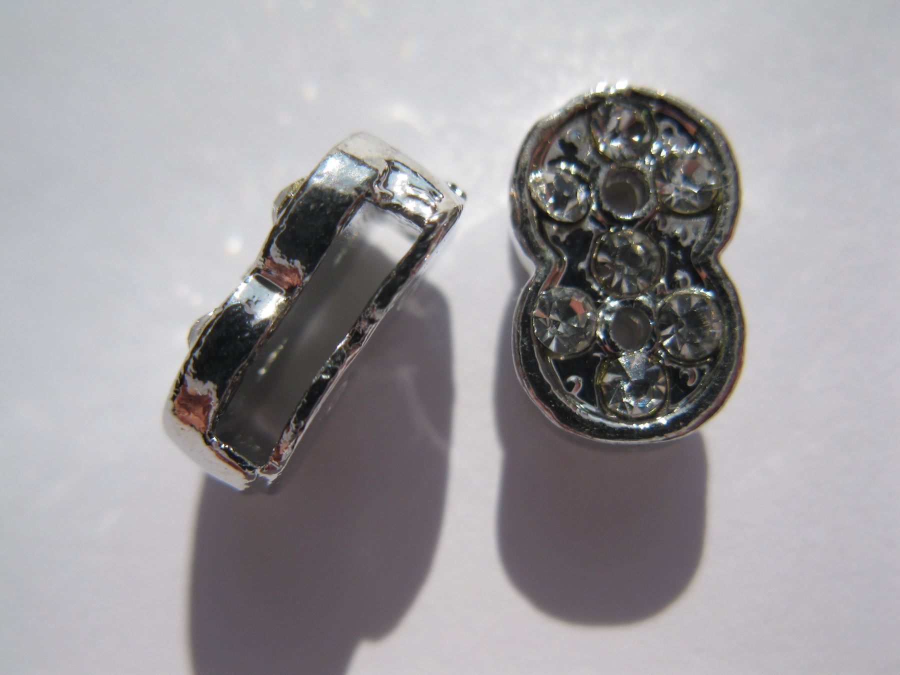 Perle (finte): 2 Schiebeperlen mit Strass infinity, 11mm – Nuovo e nell'imballaggio originale da St. Margarethen TG venduto da LuanaKa 1