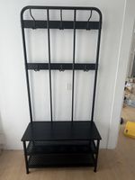 Black coat and shoe rack