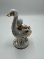Porzellanfigur Kind auf Schwan, Vintage
