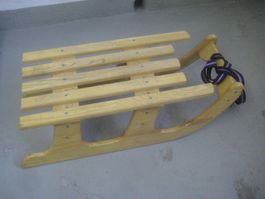 HOLZSCHLITTEN