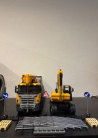 Spielzeug Baufahrzeuge Scania Kran und CAT Bagger gut