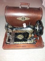 Machine à coudre Singer vintage avec coffret bois