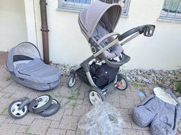 Kinderwagen Stokke grau mit viel Zubehör gebraucht