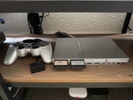 PlayStation 2 mit Spielen und Controller
