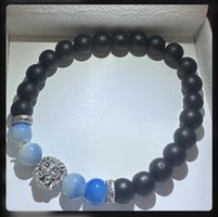 Blue and black beaded bracelet with lion charm #beadedbracel