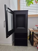 Cheminée au bioéthanil noir avec porte vitrée et rangement