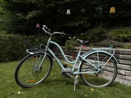 Vélo électrique bleu clair vintage
