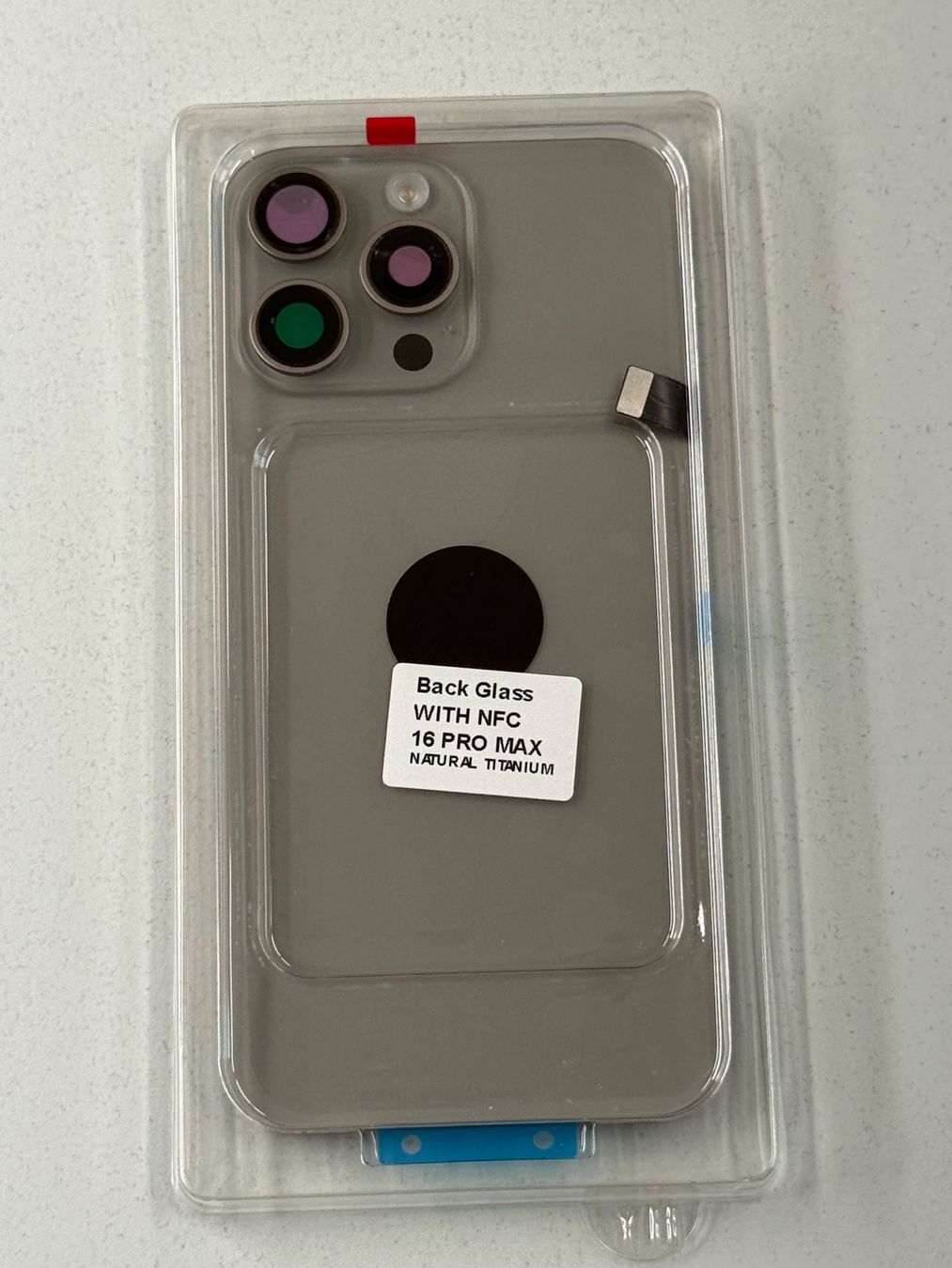Apple Telefoni cellulari / Smartphones: Vitre Arrière pour iPhone 16 Pro Max avec NFC | Flash – Nuovo e nell'imballaggio originale da Zug venduto da ElPhone 2