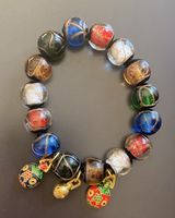 Unique Glass Beaded Bracelet with Charm Details
