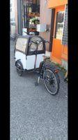 Vélo cargo électrique avec bâche