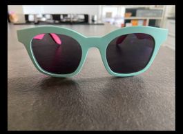 Swatch Sonnenbrille in Aquagrün und Rose