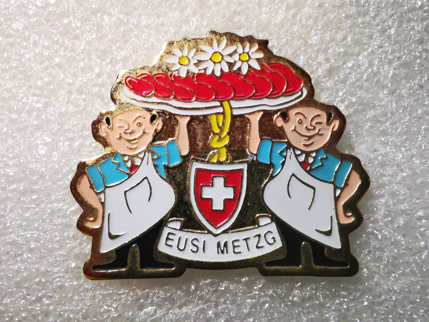 Plaketten & Abzeichen: Ansteckpin 15: Eusi Metzg – Gebraucht aus Oppligen von Pin-Fall-Shop