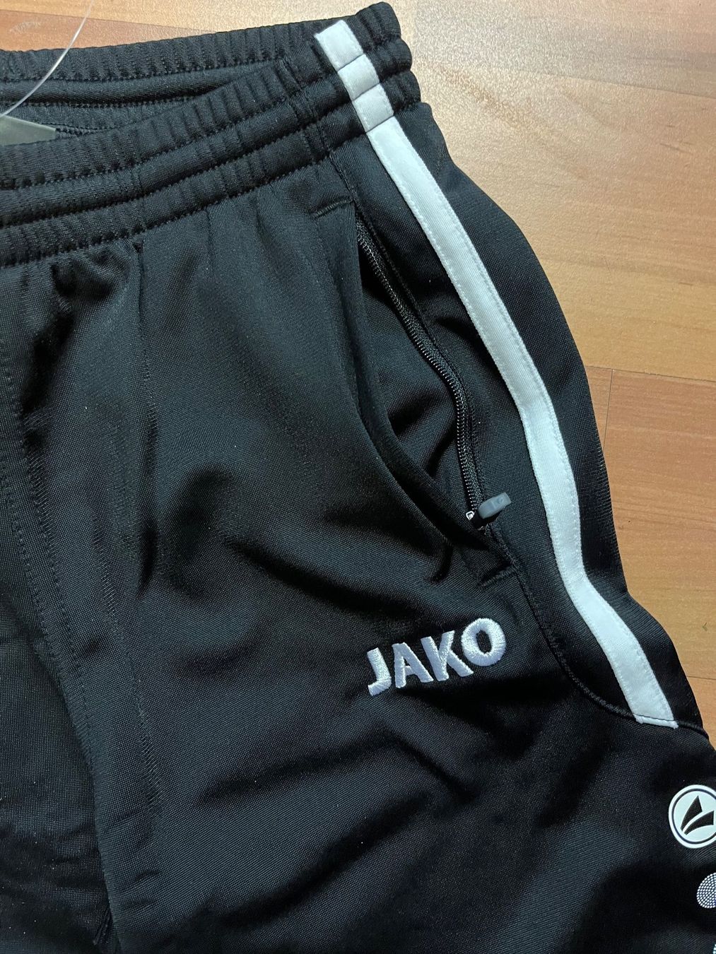 Jako-O Completi: JAKO Junioren Trainer, hellgrau/schwarz,  Grösse164 – Nuovo e nell'imballaggio originale da Adliswil venduto da vette56 3