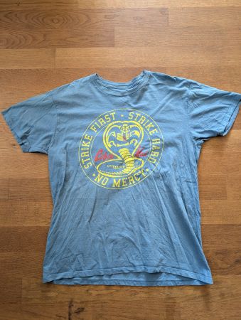 Cobra Kai T-Shirt – Strike First Strike Hard No Mercy
