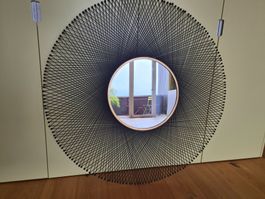 Wandspiegel rund mit schwarzem Metallgeflecht 115 cm