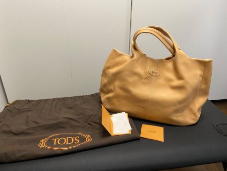 Authentique sac à main Tods en cuir beige de taille moyenne