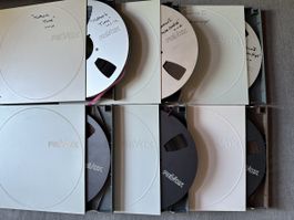 7 Revox 26,5-cm-Tonbandspulen – 6× Band, 1× leer